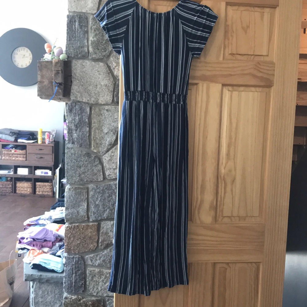 Girls Romper Size Medium. Side pockets